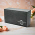 An elegant charcoal gift box with the Churchill's Fine Teas logo, containing a set of tea tins.