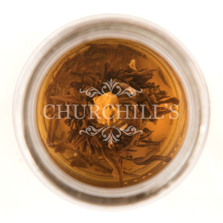 Tiffany Rose Bud Blooming Green Tea (brewed, top view)